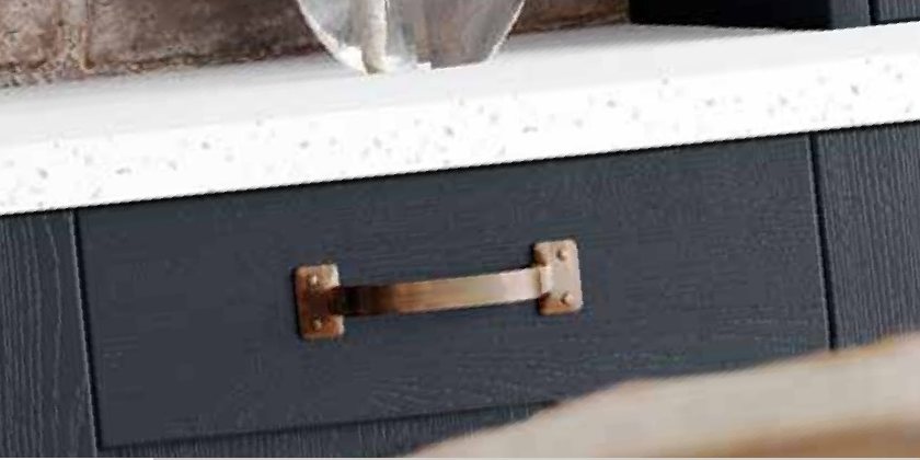 Copper handle on an indigo drawer